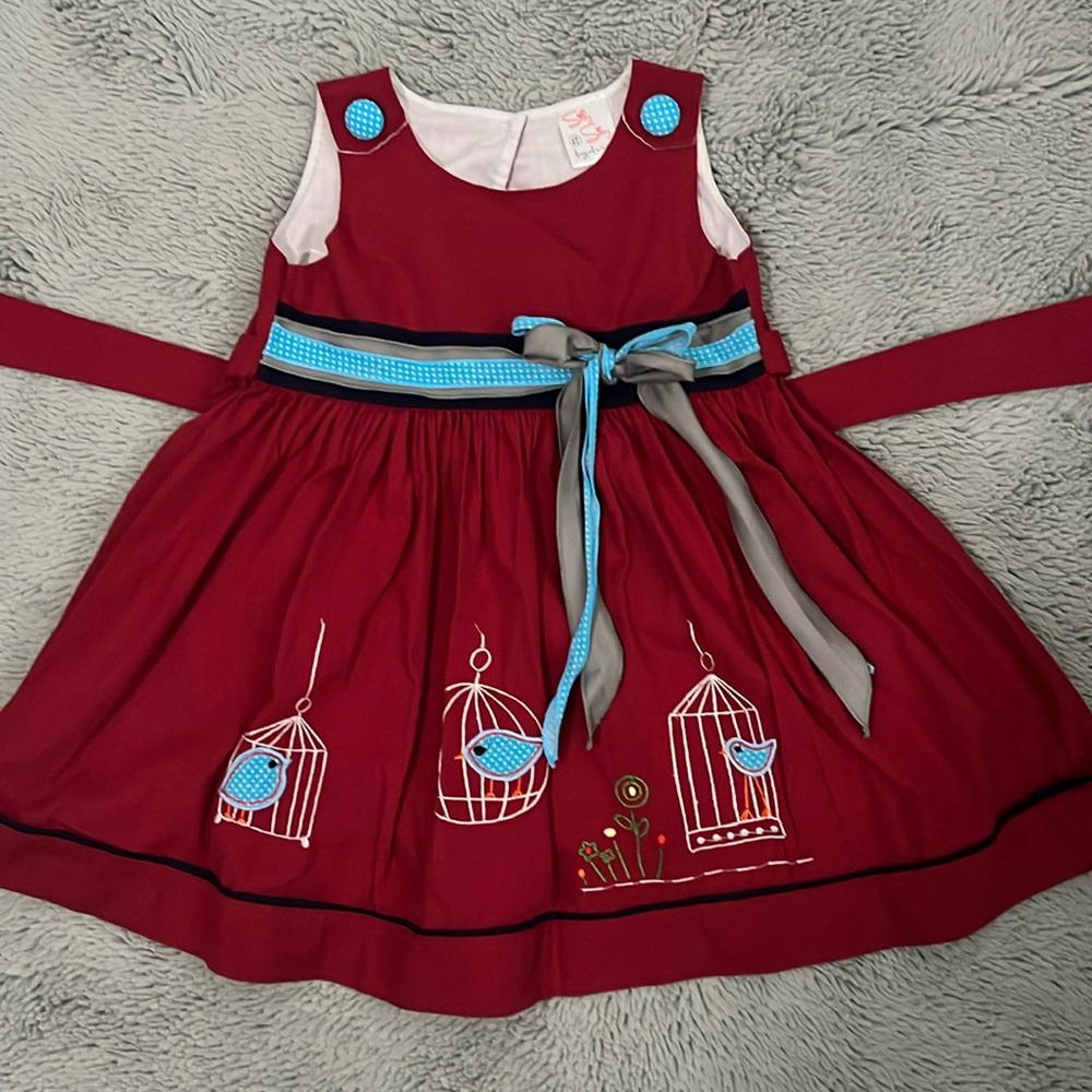 Red embroidered dress with blue birds